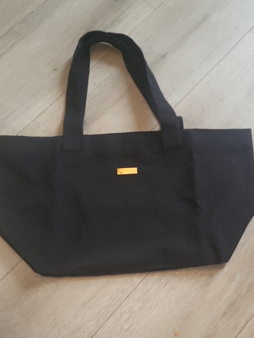 Shiseido Black Fabric Item with Gold Logo Plate